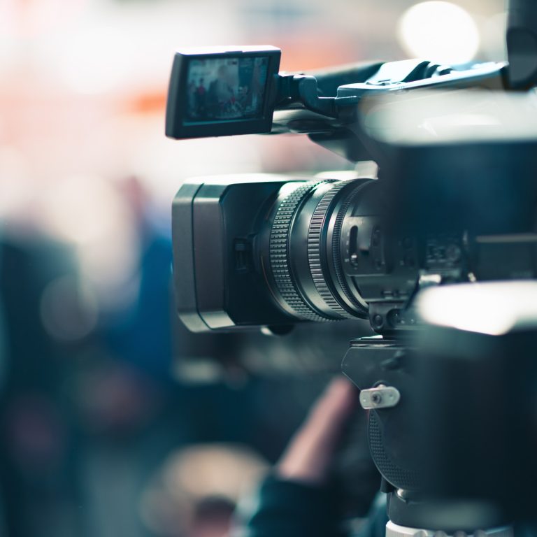 Camera at a media conference